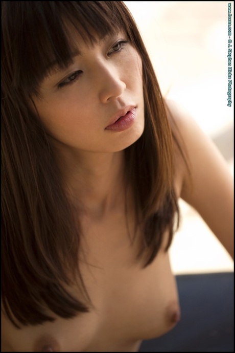 Beautiful Asian model Marica Hase strikes great poses while removing lingerie