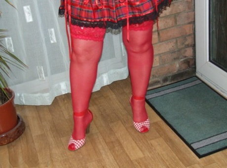 Fat amateur with short hair Kinky Carol exposes her huge tits in red nylons