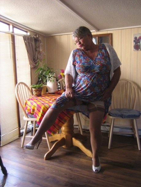 Fat granny Girdle Goddess exposes her huge boobs in a girdle and nylons