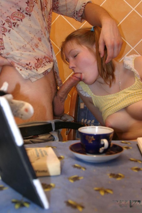 Young looking redhead takes it up the ass in long socks and pigtails
