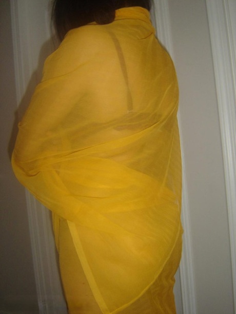 Chubby Indian female frees her shaved pussy and butt from a wrap