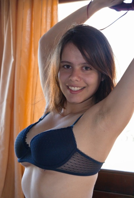 Amateur girl Akito reveals the pink inside her natural pussy atop her bed