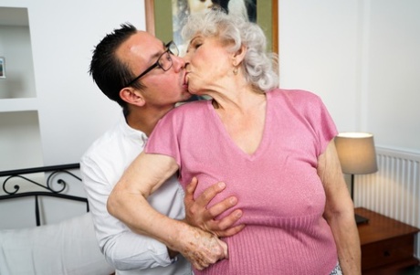 Old woman Norma B has her hairy muff licked before being banged by her toy boy