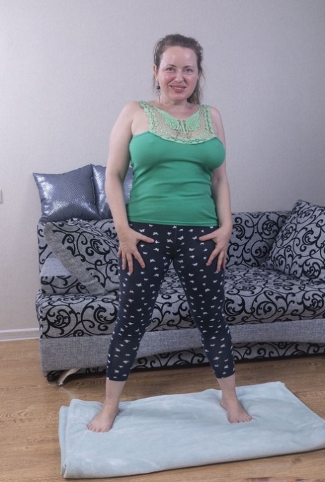 Chubby amateur Eva Brawn uncovers large tits before showing her natural pussy