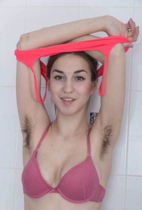 Nasty girl Halmia gladly shows off her puffy nipples and a furry twat