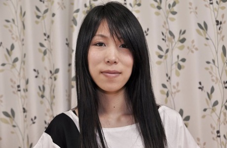 Slippy asian MILF Yuko Mukai stripping down and toying her hairy gash