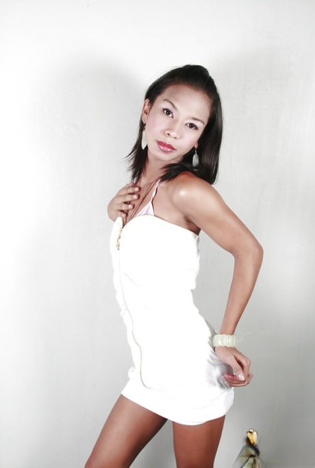Petite Asian ladyboy Nika showing off tiny teen tits before masturbating