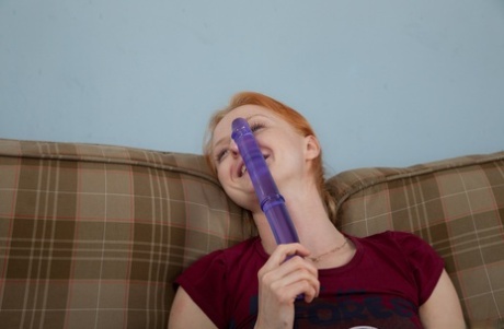 Petite redhead Alexia toying her horny hairy pussy with a long dildo