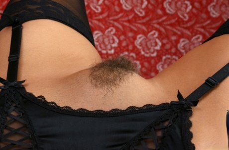 Skinny mom with a hairy muff Jolie strips and poses in sweet lingerie