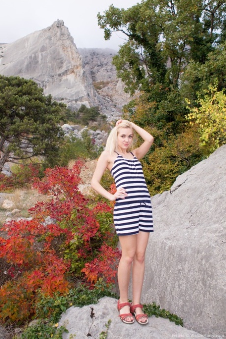 Skinny blonde Felicia stripping & showing off her furry muff on rocky mountain