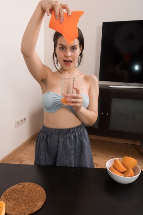 Amateur teen Ole Nina exposes her big juggs and hairy pussy in a solo