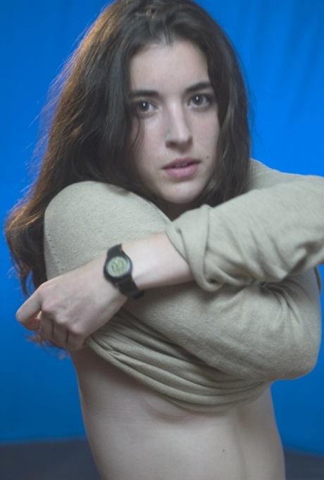 All-natural teen Elsi A strips naked & shows her unshaven armpits & pussy