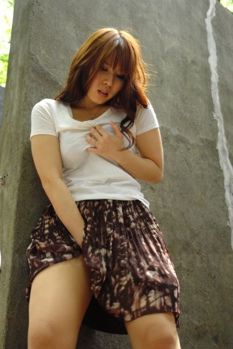 Asian brunette Eri Makino plays with her big juggs and gets fucked outdoors
