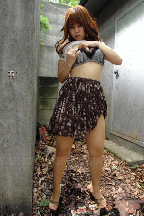 Asian brunette Eri Makino plays with her big juggs and gets fucked outdoors