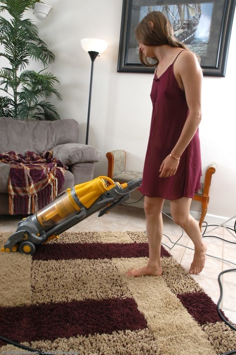 Naughty MILF Maddy exposes her amazing hairy pussy while doing housework