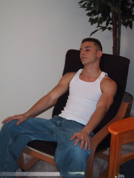 Handsome twink Sharif undresses and masturbates in a chair at the casting