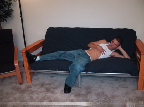 Handsome twink Sharif undresses and masturbates in a chair at the casting