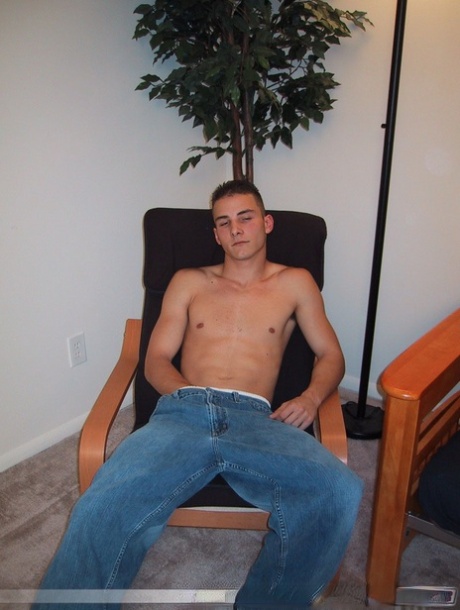 Handsome twink Sharif undresses and masturbates in a chair at the casting