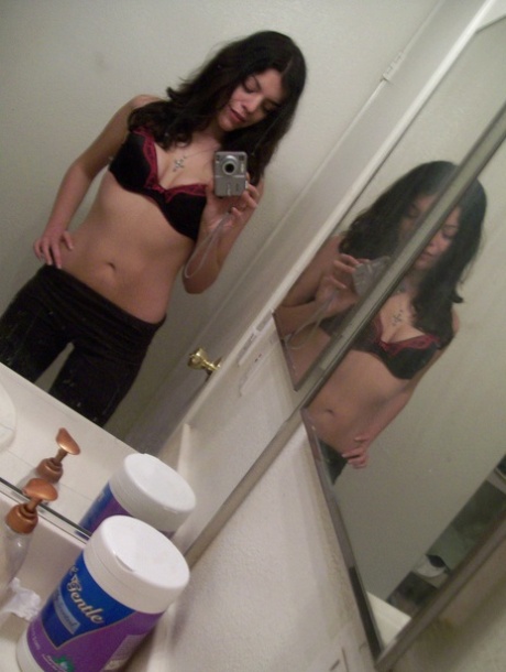 Dark haired teen takes selfies of her nice ass & natural tits in the mirror