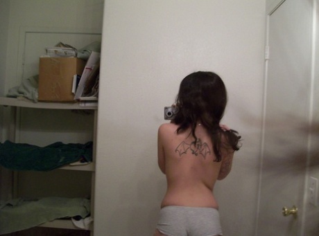 Dark haired teen takes selfies of her nice ass & natural tits in the mirror