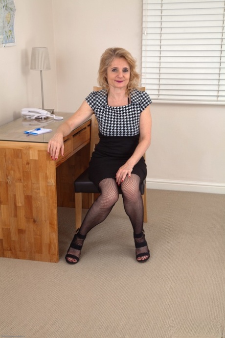 Petite mature teacher Isabella Diana spreads her hairy pussy in the classroom