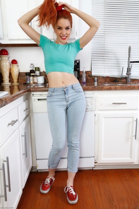 Redheaded amateur teen Amarna Miller spreads her hairy pussy in the kitchen