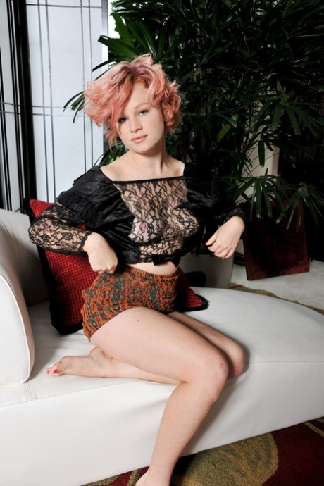 Redheaded cutie with blue eyes Mona exposes her hairy hole and poses in a solo