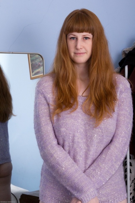 Redheaded amateur teen Chloe B shows her twat and beautiful big tits in a solo