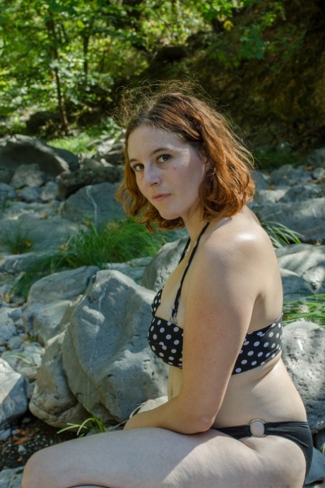 Redheaded beauty Eleanor Rose exposing her big tits & hairy twat in the forest