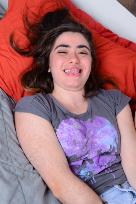 Hairy babe Kisa Fae undresses and plays with her super furry vagina