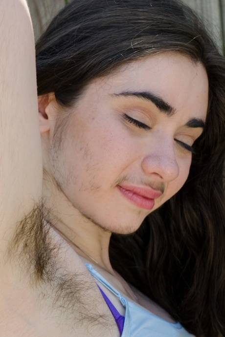 Hairy amateur Kisa Fae strips naked & displays her meaty pussy lips up close
