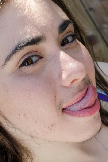 Hairy amateur Kisa Fae strips naked & displays her meaty pussy lips up close