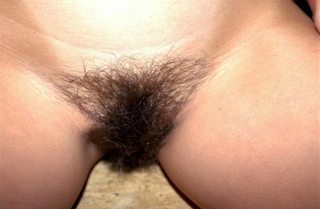 Gorgeous brunette Gloria shows her tanned tits & her inviting hairy pussy