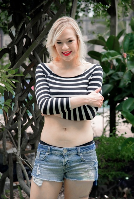 Blonde with red lipstick Rebecca Vanguard strips & massages a dick outside