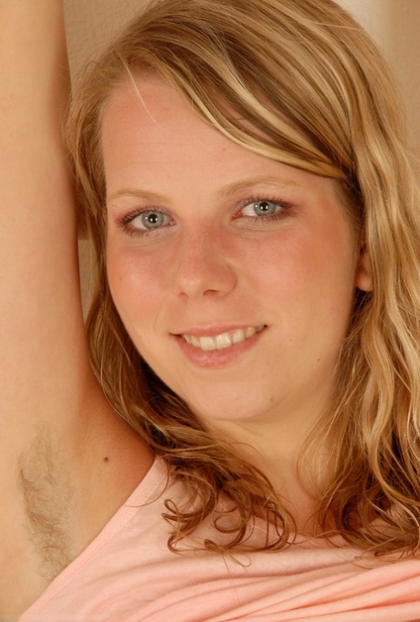 Blonde teen with blue eyes Susie exposes her big tits and tasty pussy