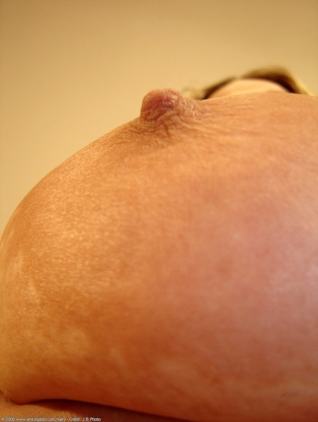 Chubby amateur Amber toys her hairy pussy with a dildo up close