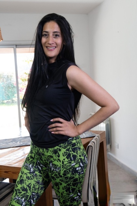 Exotic brunette Francesca spreading her furry pussy on the dining table