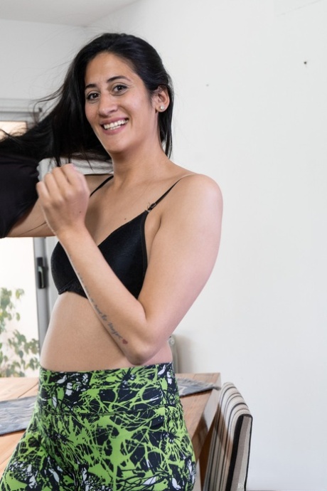 Exotic brunette Francesca spreading her furry pussy on the dining table