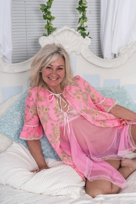 Alluring blonde granny Ellen B doffs her pink pajamas and flaunts her bush
