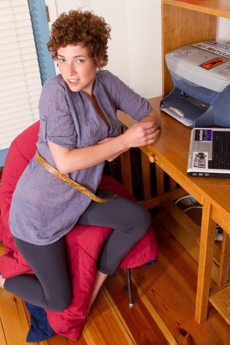Cutie Julia B strips in front of her laptop and shows her hairy bush