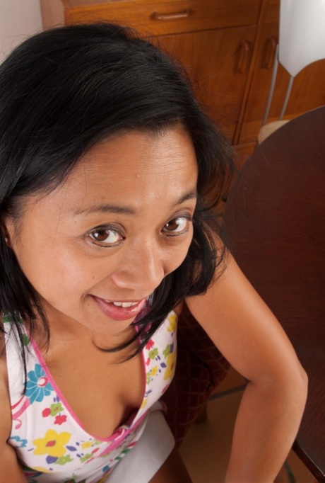 Short Asian mom Lucky Starr undresses and spreads her mature snatch